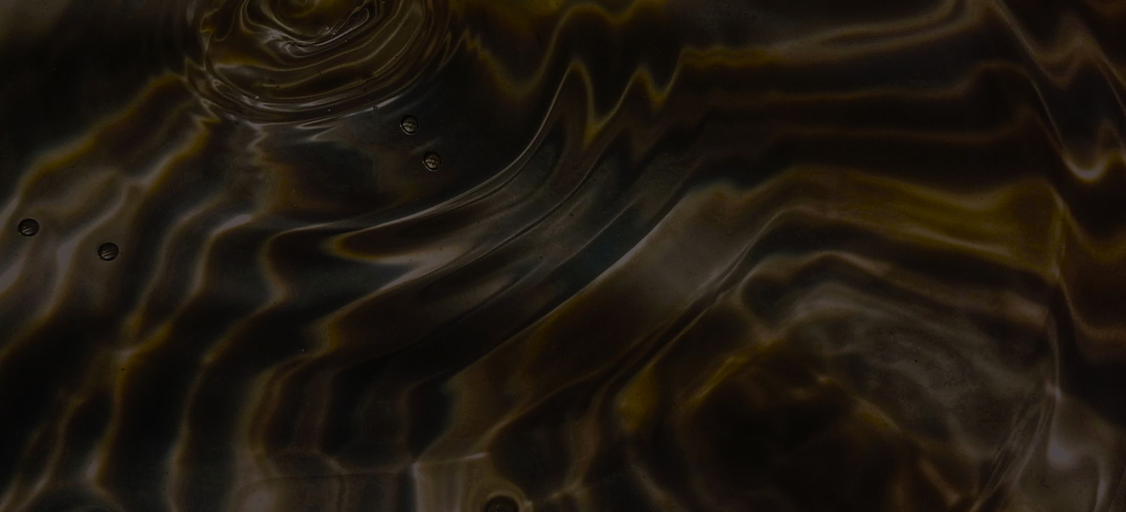 Abstract pattern of neatly arranged metallic objects.