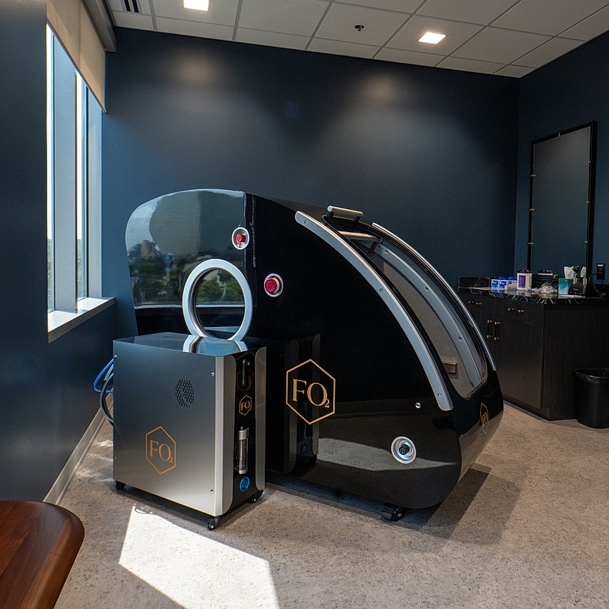 Hyperbaric oxygen therapy machine in modern room.