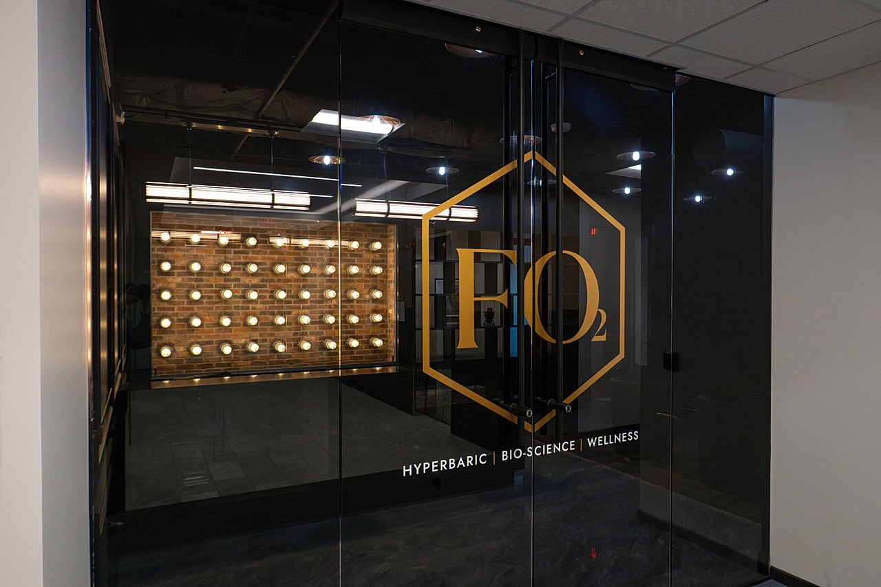 FO₂ wellness center entrance with glowing lights.