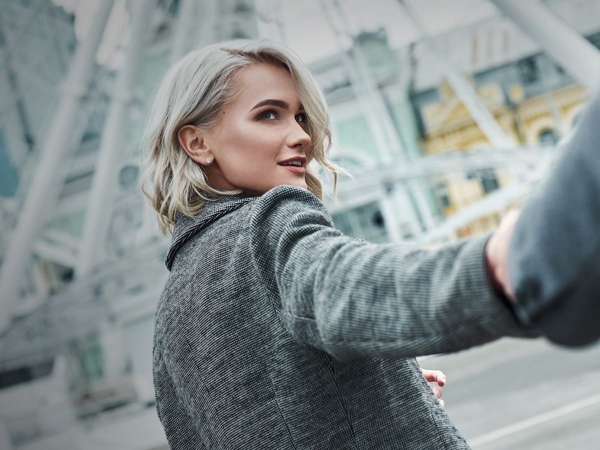 Hyperbaric Oxygen Therapy model looking back while holding someone's hand.